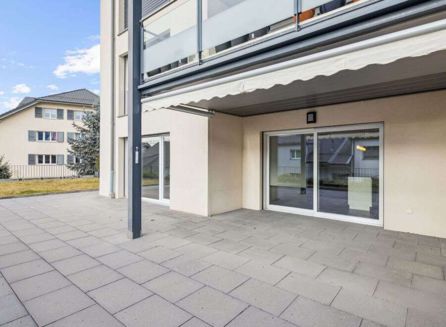 Discover modern living in this stunning property featuring a spacious patio, perfect for outdoor relaxation and entertaining.