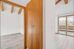 Discover the charm of this inviting property, featuring a beautifully crafted wooden wardrobe and a bright, airy interior.