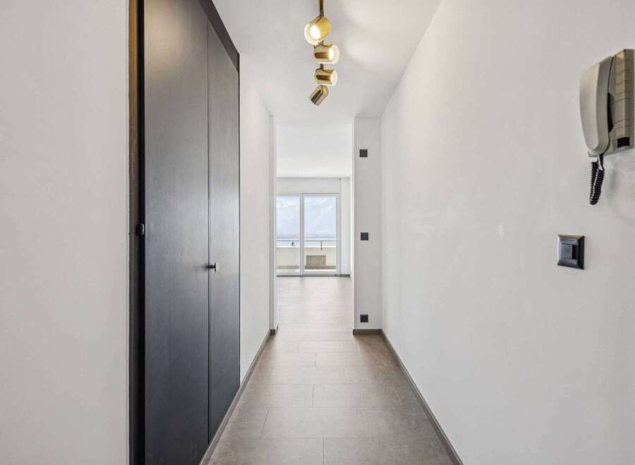 Step into this inviting hallway, featuring a sleek, modern design.