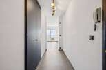Step into this inviting hallway, featuring a sleek, modern design.