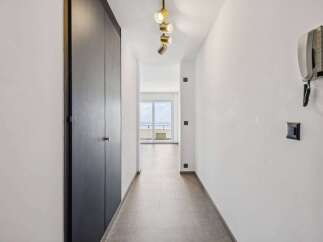 Step into this inviting hallway, featuring a sleek, modern design.
