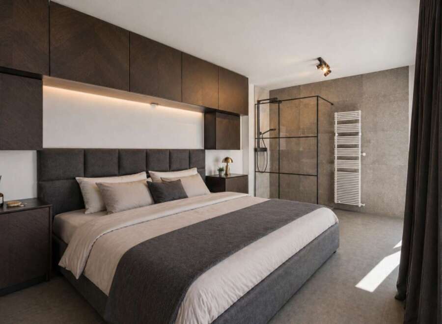 Experience luxury in this modern bedroom featuring a sleek design and high-end finishes.