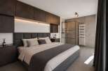 Experience luxury in this modern bedroom featuring a sleek design and high-end finishes.