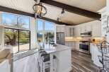 This stunning kitchen boasts a modern design with high-end finishes.