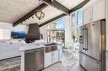 Experience luxury living in this stunning kitchen! Featuring a modern design with stainless steel appliances, a spacious island, and a beautiful view, this kitchen is perfect for cooking and entertaining.
