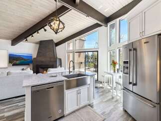 Experience luxury living in this stunning kitchen! Featuring a modern design with stainless steel appliances, a spacious island, and a beautiful view, this kitchen is perfect for cooking and entertaining.