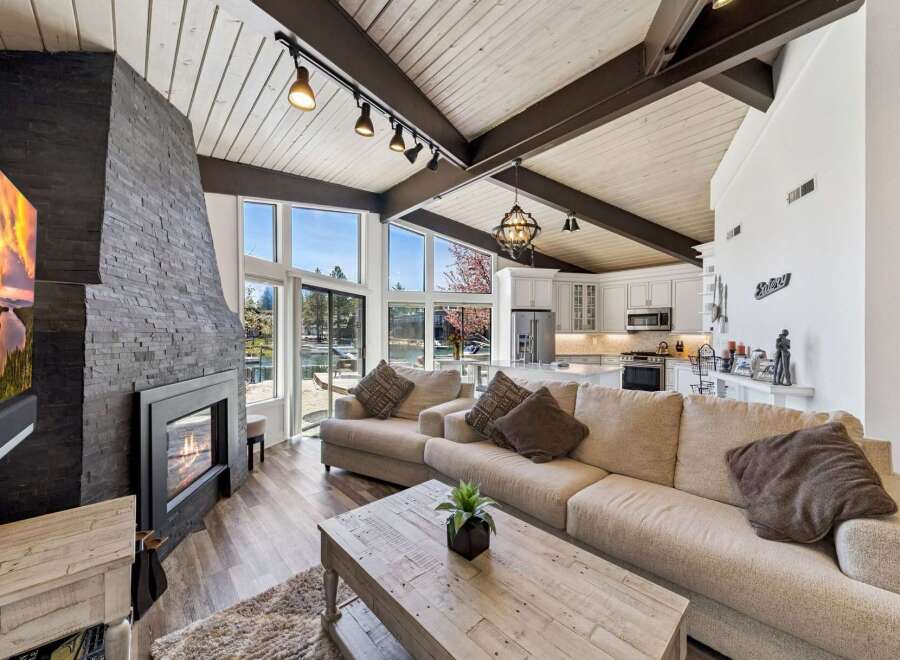 Experience luxury living in this stunning property featuring a cozy fireplace and a spacious living area.