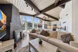 Experience luxury living in this stunning property featuring a cozy fireplace and a spacious living area.