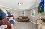 This cozy bedroom features a bunk bed, perfect for accommodating guests or family.