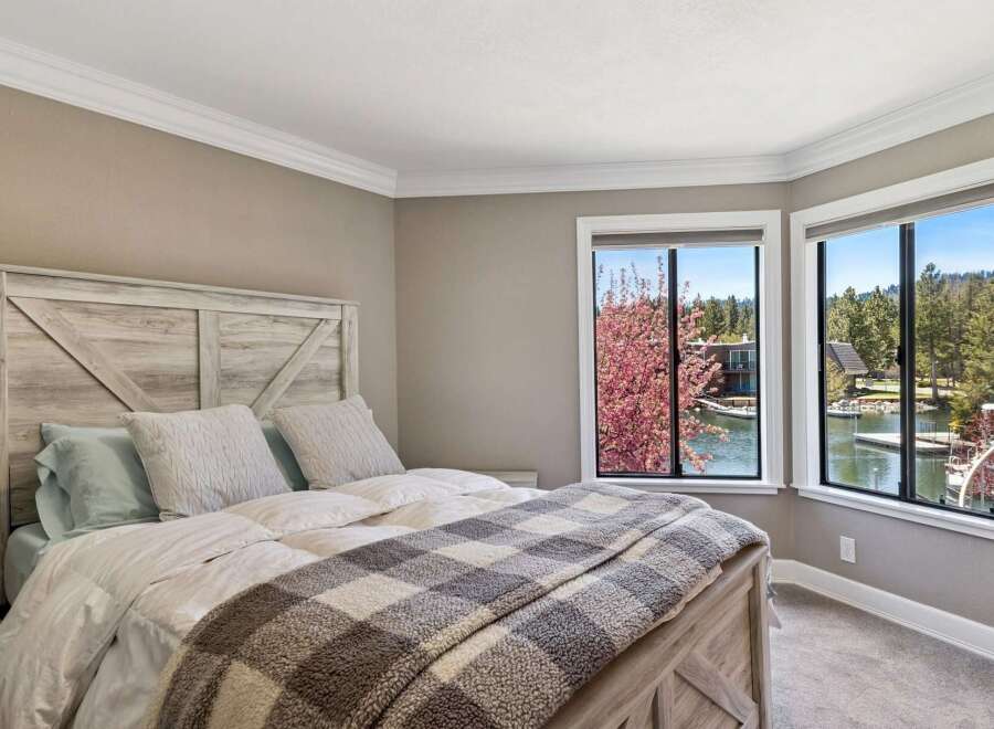 Experience serene waterfront living in this stunning bedroom.