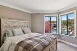 Experience serene waterfront living in this stunning bedroom.