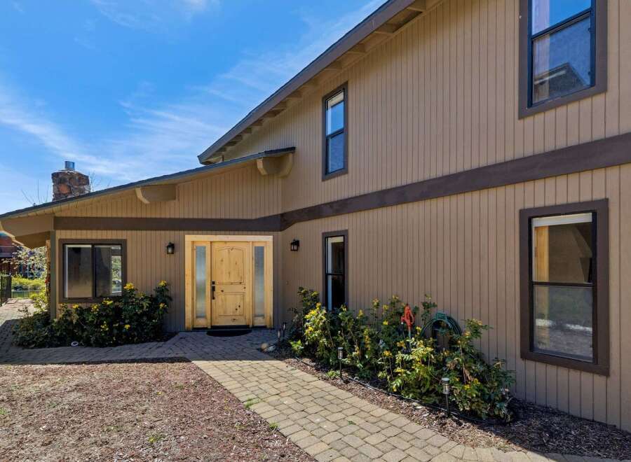 This stunning property boasts a beautiful exterior with a welcoming entrance.