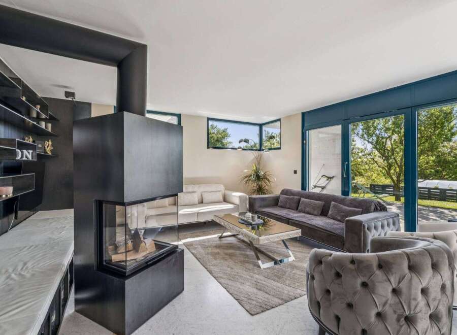Experience luxury living in this stunning property! This home boasts a modern fireplace, perfect for cozy evenings.
