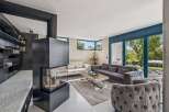 Experience luxury living in this stunning property! This home boasts a modern fireplace, perfect for cozy evenings.