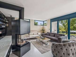 Experience luxury living in this stunning property! This home boasts a modern fireplace, perfect for cozy evenings.