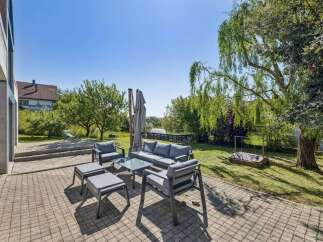 Enjoy outdoor living at its finest with this stunning property! This home features a beautifully designed patio area, perfect for entertaining or relaxing.