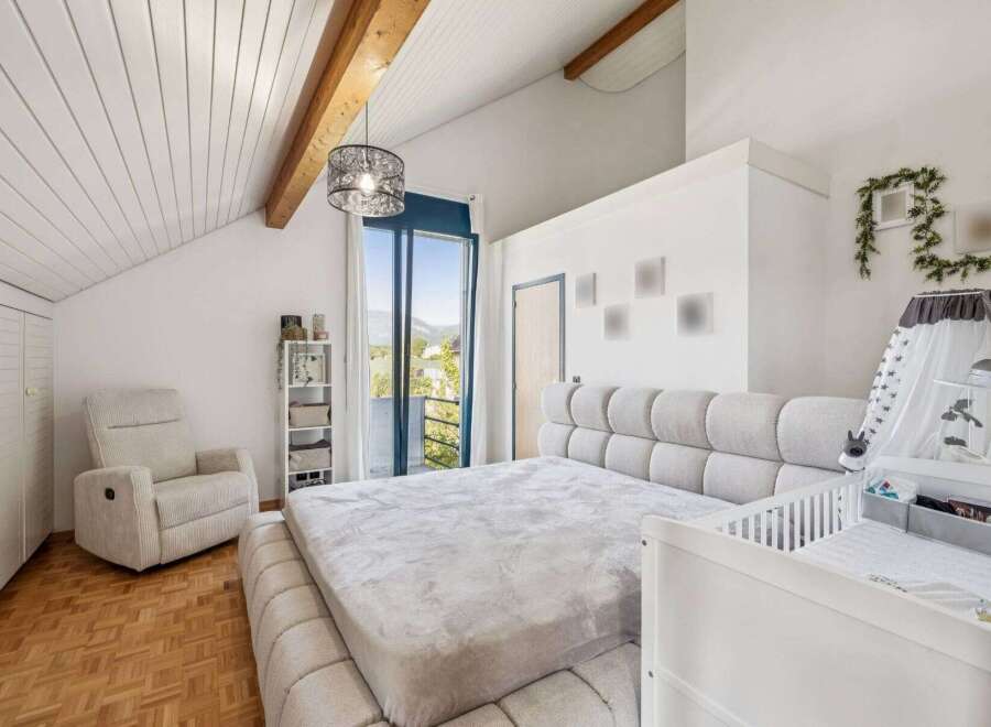 This stunning bedroom boasts a modern design with a cozy ambiance, perfect for relaxation.