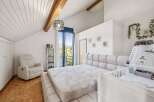 This stunning bedroom boasts a modern design with a cozy ambiance, perfect for relaxation.