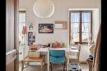 This charming room offers a bright and inviting space, perfect for a home office or creative studio.