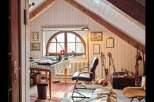 Step into a charming attic office space, perfect for creative pursuits or focused work.