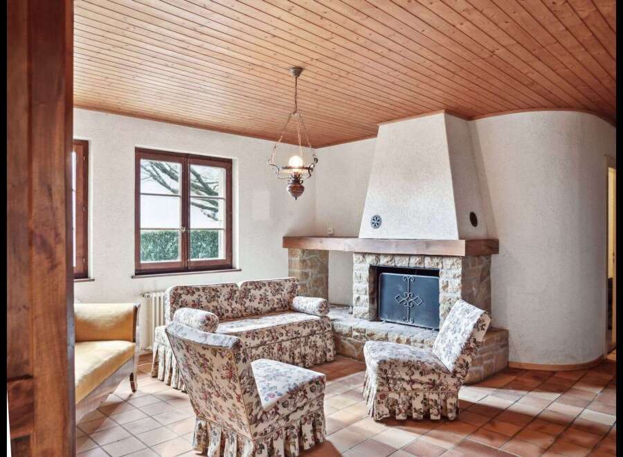 Step into a cozy living space featuring a charming fireplace, perfect for those chilly evenings.