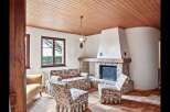 Step into a cozy living space featuring a charming fireplace, perfect for those chilly evenings.