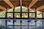 This luxurious indoor pool offers stunning views of the surrounding mountains and forests.