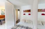 Discover this cozy bedroom featuring a comfortable bed, perfect for relaxation.