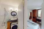 Discover this charming property featuring a well-appointed bathroom with a modern sink and a convenient washing machine.