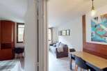Discover this cozy apartment featuring a comfortable living area and a well-equipped dining space.
