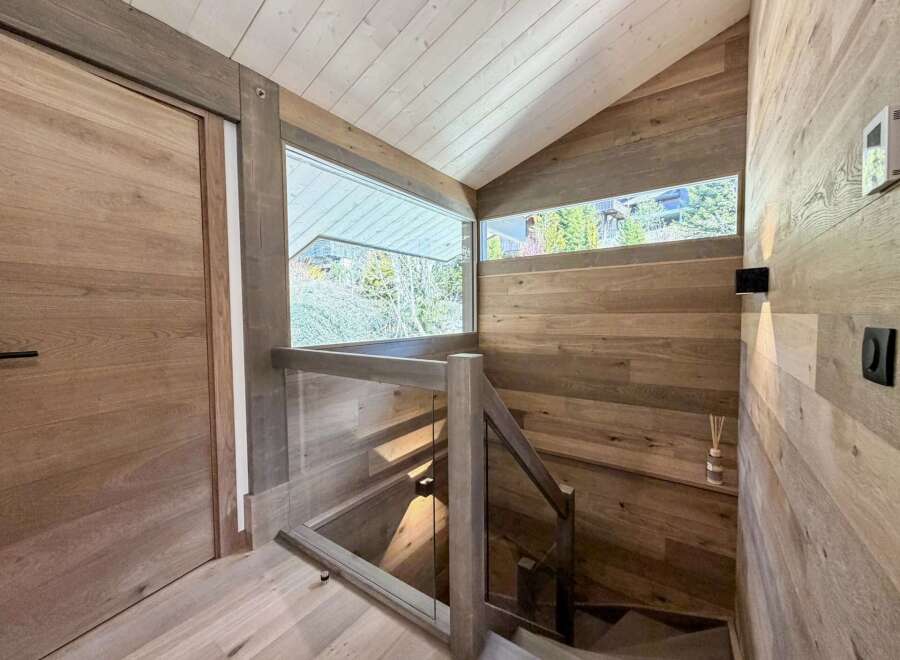 This stunning property boasts a modern interior with a focus on natural materials.