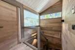 This stunning property boasts a modern interior with a focus on natural materials.