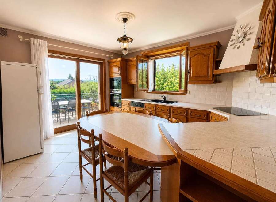 This stunning kitchen boasts a seamless blend of classic design and modern functionality.