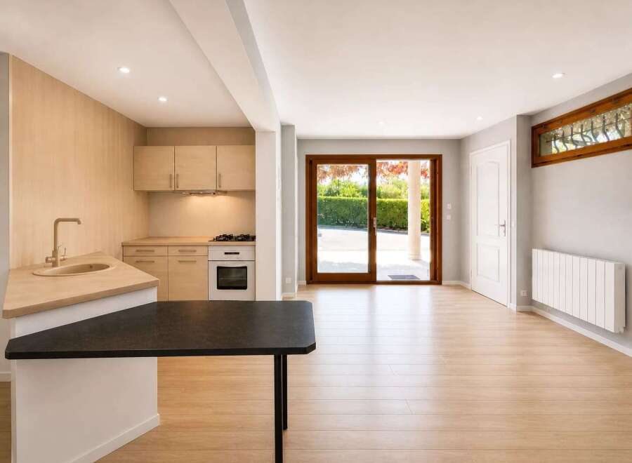 This stunning property boasts a modern kitchen with sleek cabinetry and a stylish countertop, perfect for culinary enthusiasts.