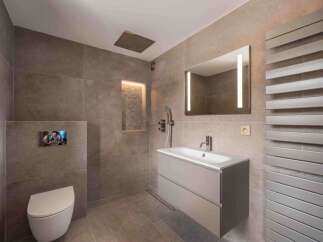 This modern bathroom boasts sleek design and luxurious features.