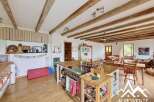 This charming property boasts a rustic kitchen with a large island, perfect for cooking and entertaining.