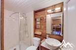 Discover this charming bathroom featuring a modern shower, a stylish sink, and a comfortable toilet.