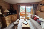 Experience the charm of this cozy mountain retreat, featuring warm wooden interiors and stunning views.