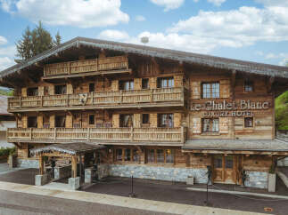 Discover the charm of Le Chalet Blanc, a luxury hotel nestled in a picturesque setting.