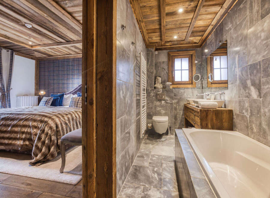 Experience luxury living in this stunning property featuring a beautifully designed bathroom and a cozy bedroom.