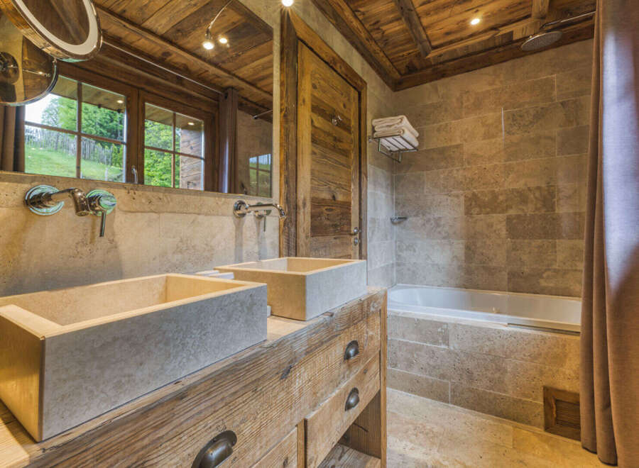 Experience rustic luxury in this stunning bathroom.