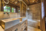 Experience rustic luxury in this stunning bathroom.