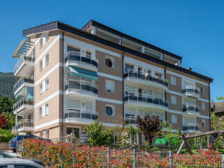 Discover modern living in this stunning apartment building, featuring spacious balconies and contemporary design.