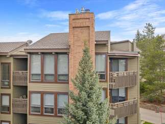 Discover the charm of this stunning property, featuring a beautiful brick chimney and inviting balconies.