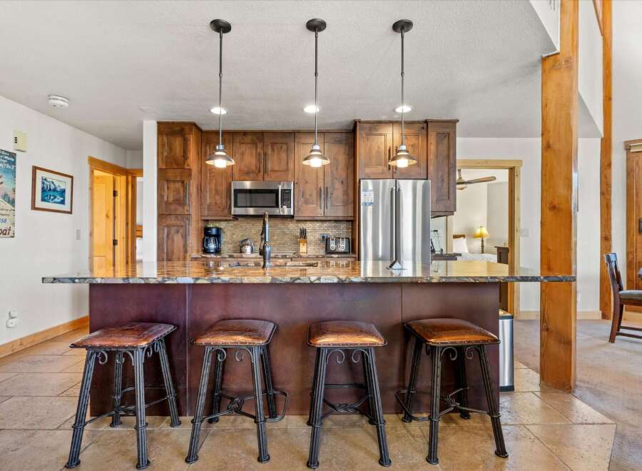This stunning kitchen features a beautiful island with seating, perfect for entertaining or casual dining.