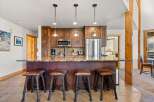 This stunning kitchen features a beautiful island with seating, perfect for entertaining or casual dining.