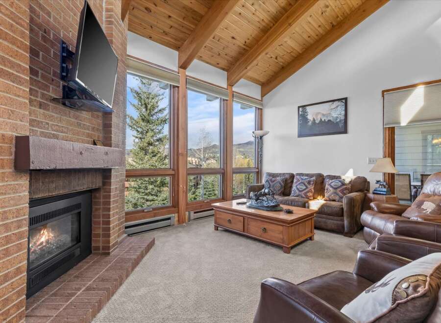 Experience luxury living in this stunning property featuring a cozy fireplace, perfect for chilly evenings.