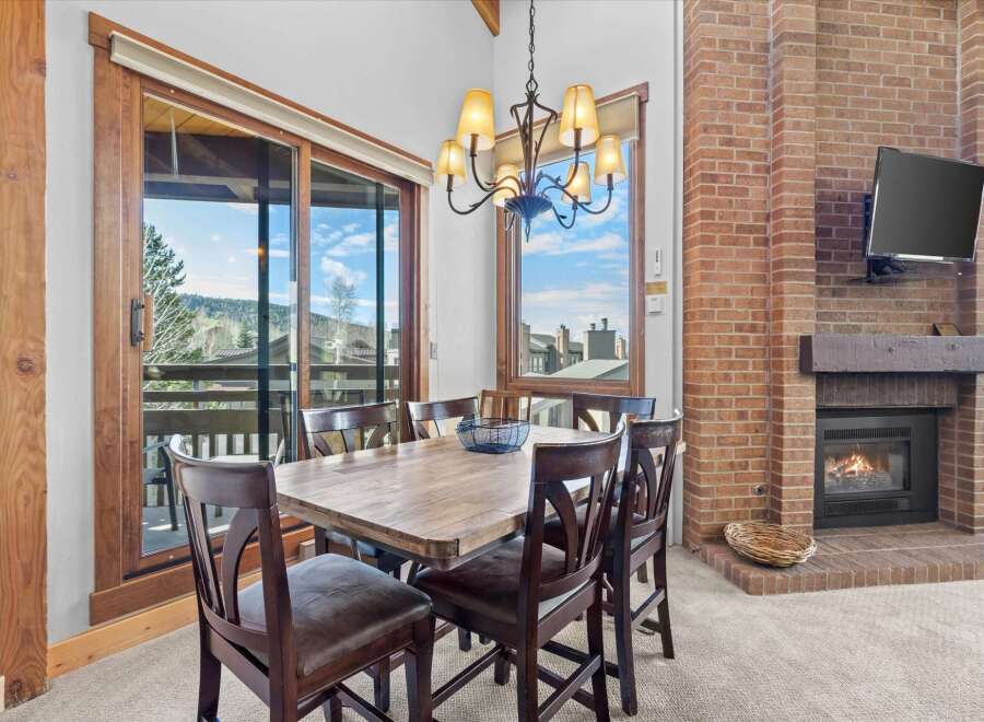This stunning property boasts a cozy dining area, perfect for intimate gatherings.