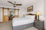 This stunning bedroom boasts a luxurious king-sized bed, perfect for a restful night's sleep.