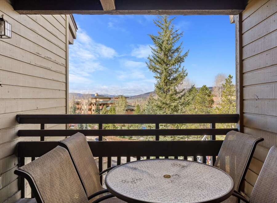 Enjoy breathtaking mountain views from this charming balcony.